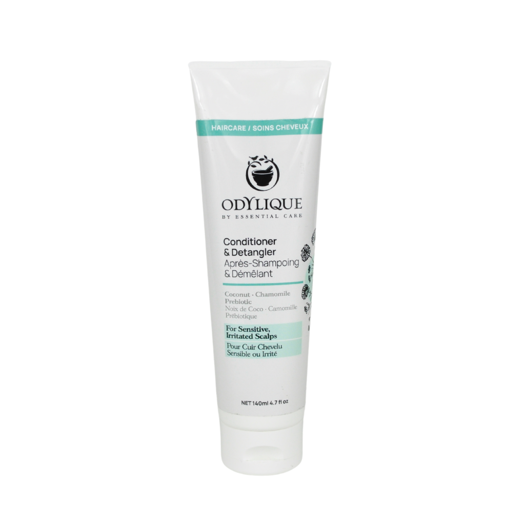 organic lightweight conditioner and detangler from odylique. Made with coconut and chamomile for sensitive scalps in a white tube with green accents.