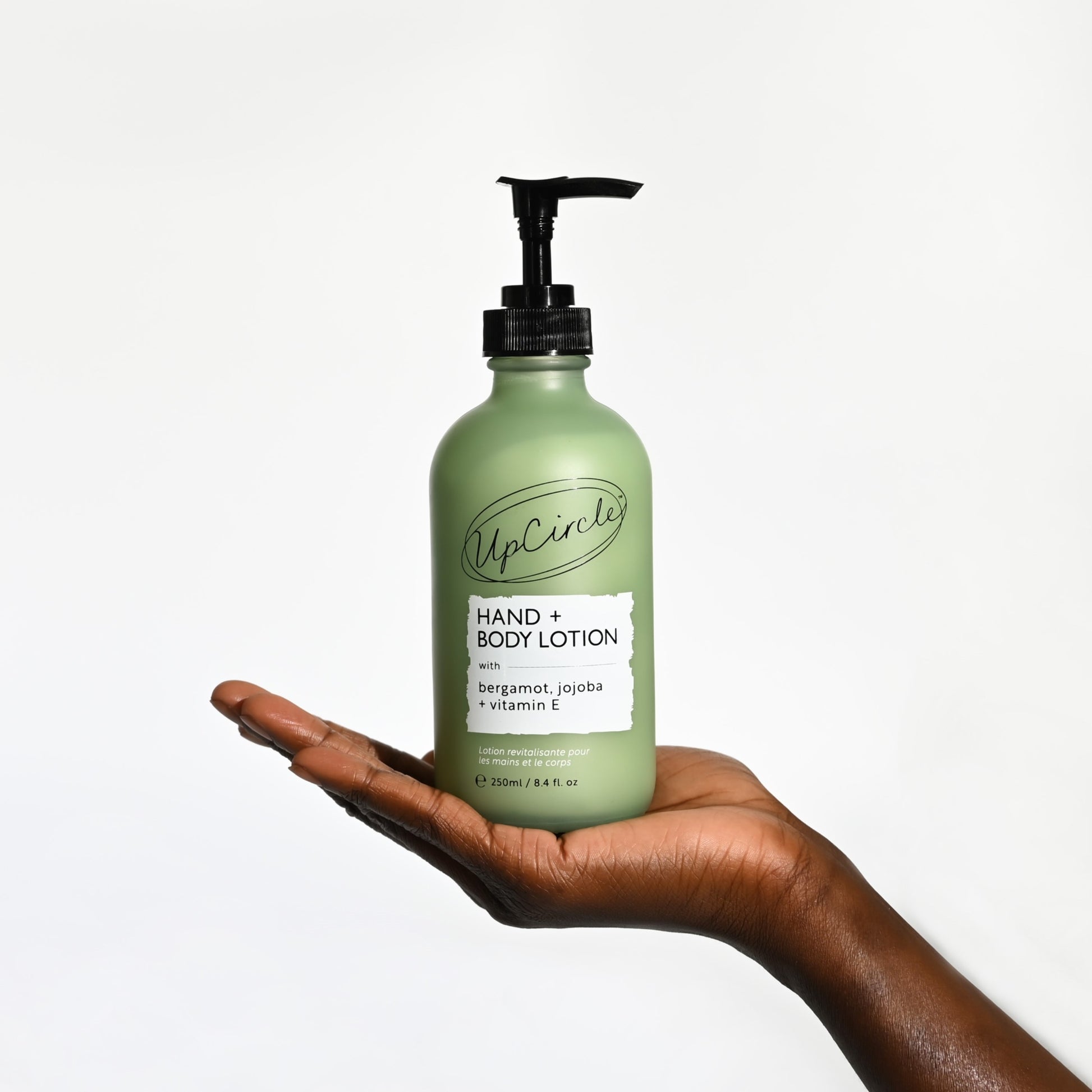 hand supporting upcircle hand and body lotion