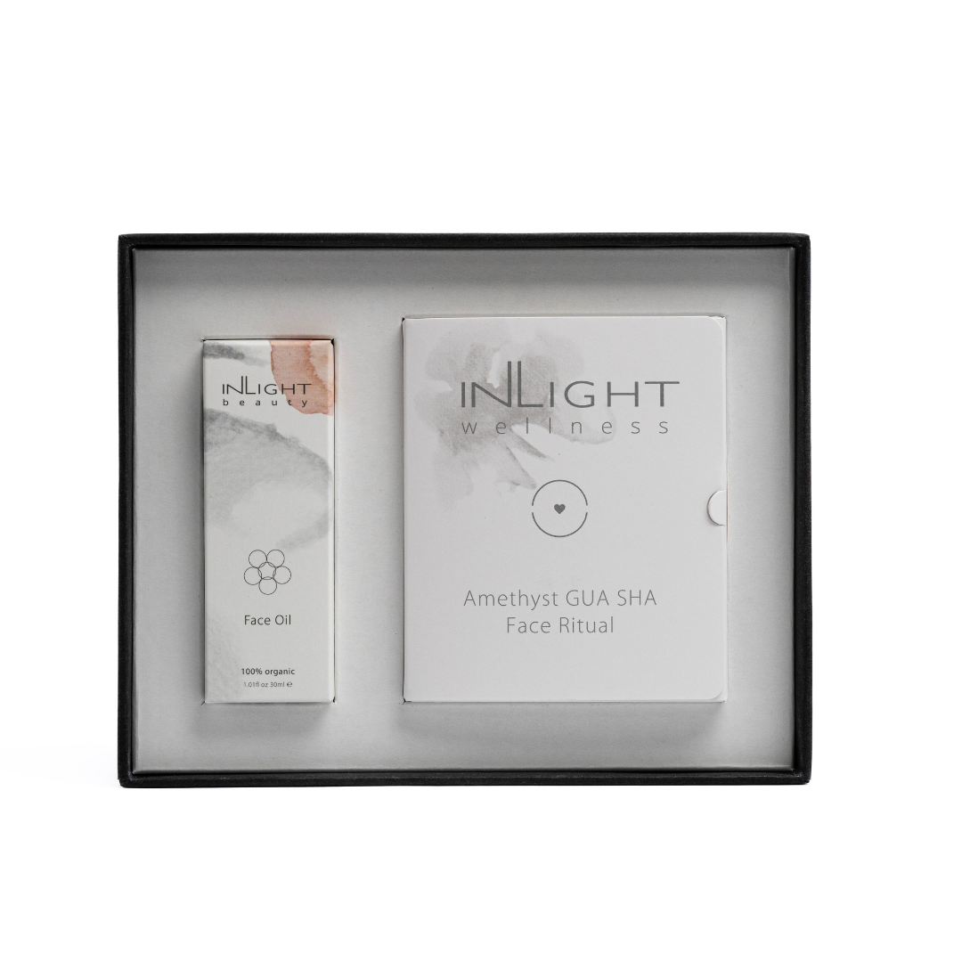 open top box of inlight beauty christmas gift set face oil and gua sha duo