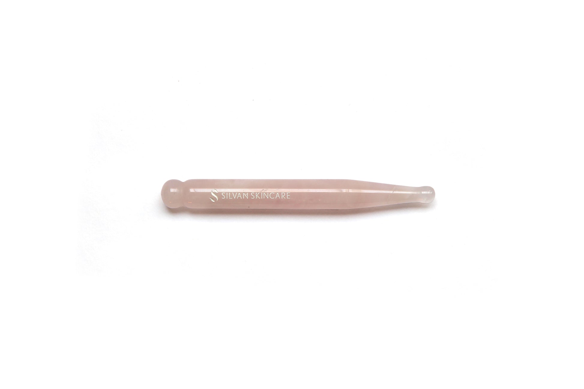 pink reflexology and acupressure tool made from rose quartz