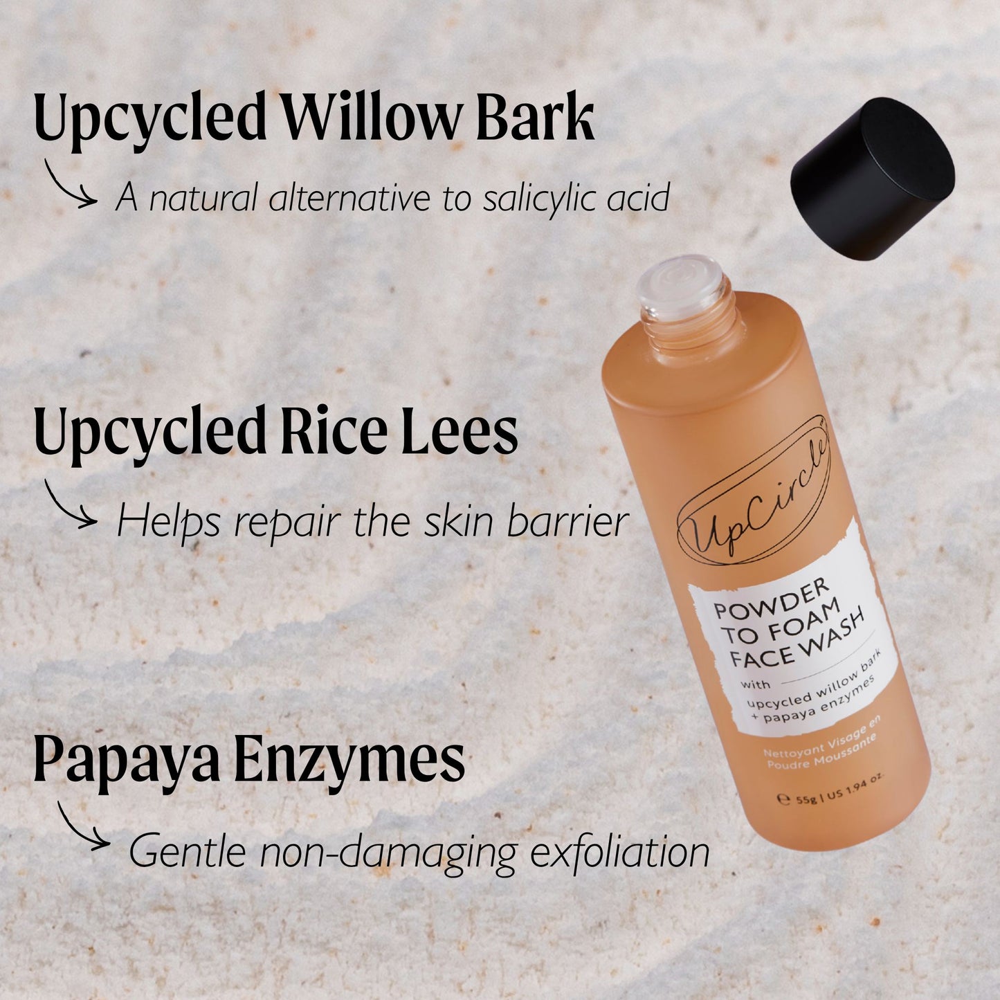 UpCircle Powder to Foam Face Wash bottle with text on a textured beige background highlighting the key ingredients