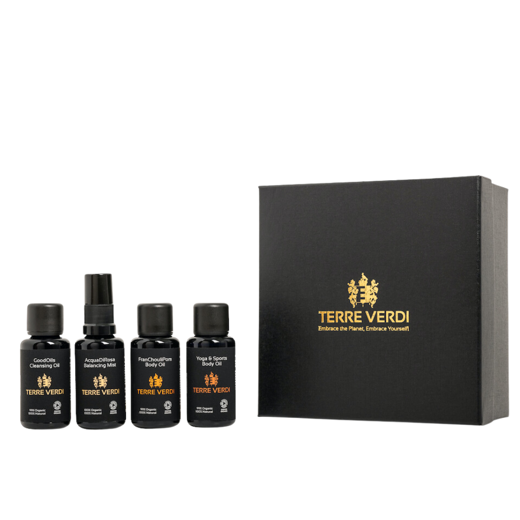 Terre Verdi Organic Travel Gift Set. Natural skincare gift set. All of the products are in black bottles and stand next to a luxury black box embossed in gold with the Terre Verdi logo.