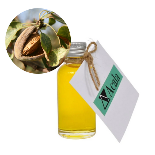 Bottle of yellow liquid with a close-up of an almond and a card with 'Acala' branding on a white background.
