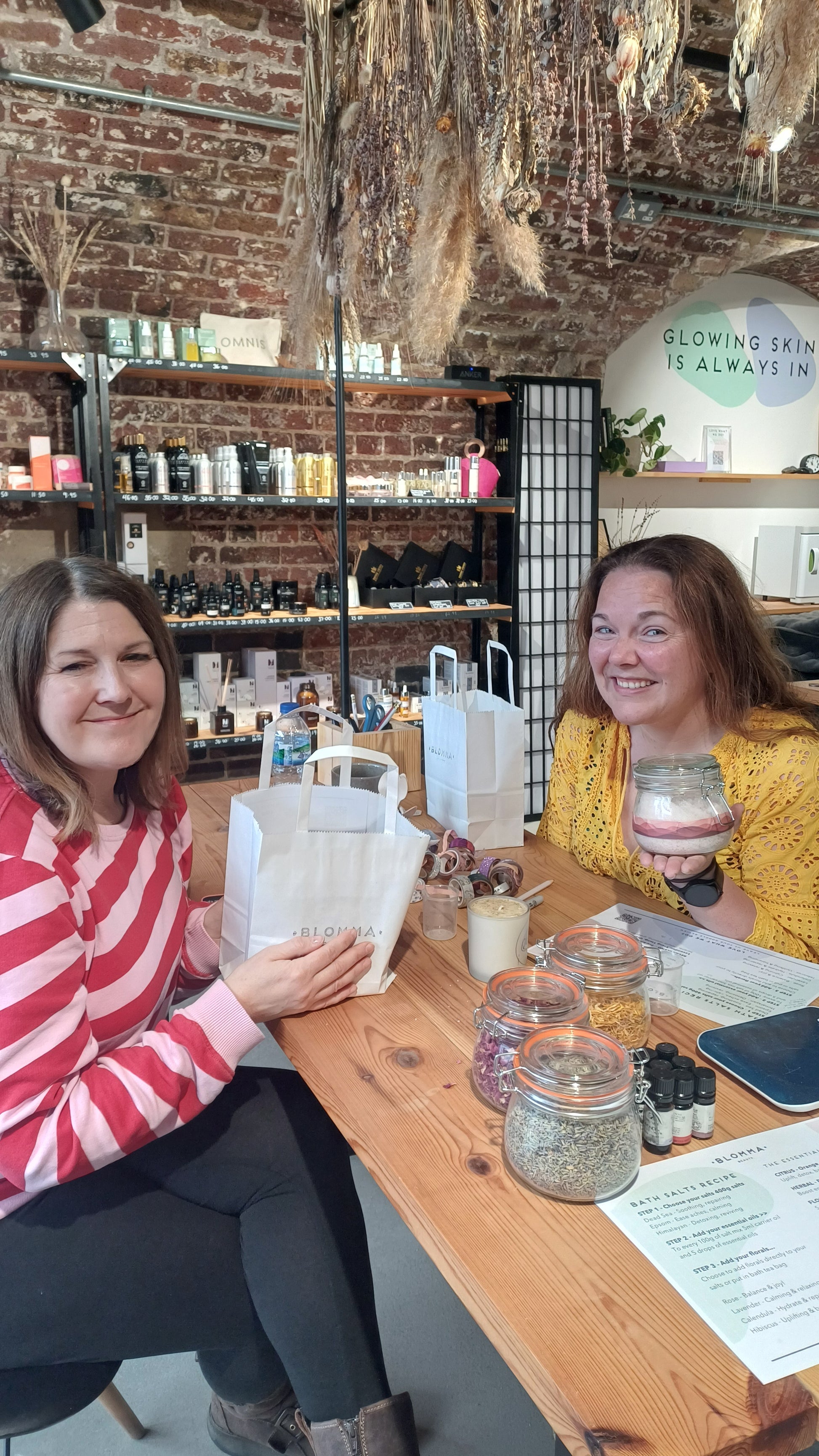 2 guests with their bath salts they have made as a birthday gift at the blomma beauty bath salt workshop