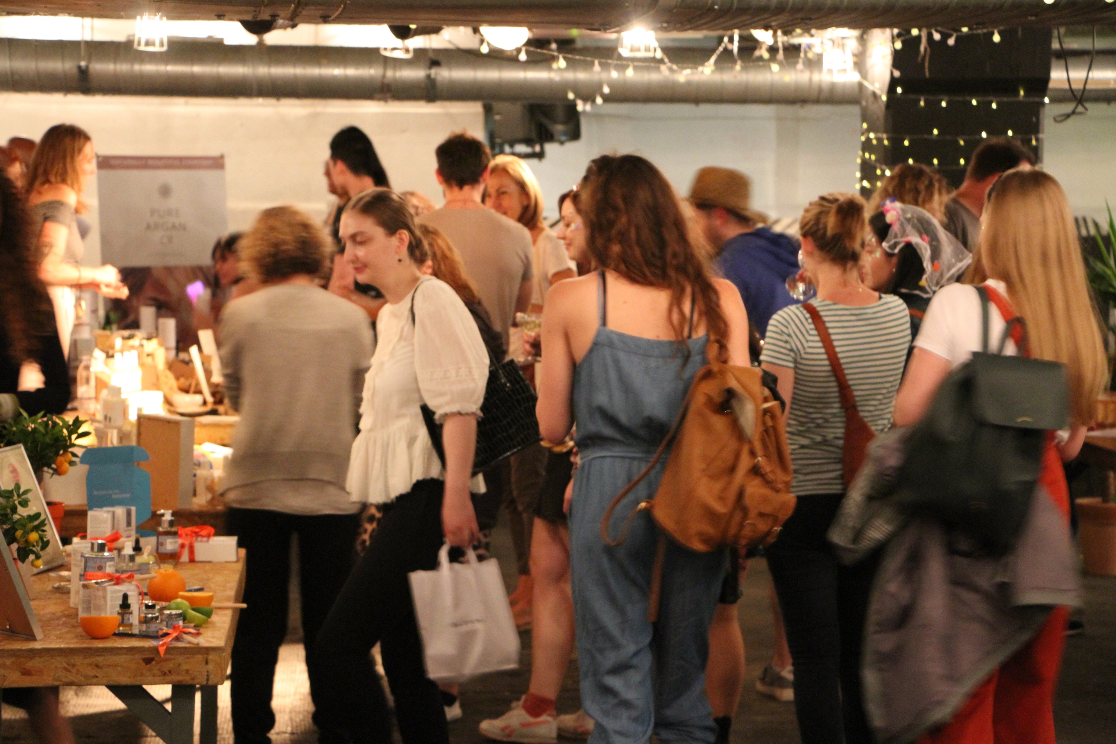 crowd of people at blomma beauty's natural beauty shopping market