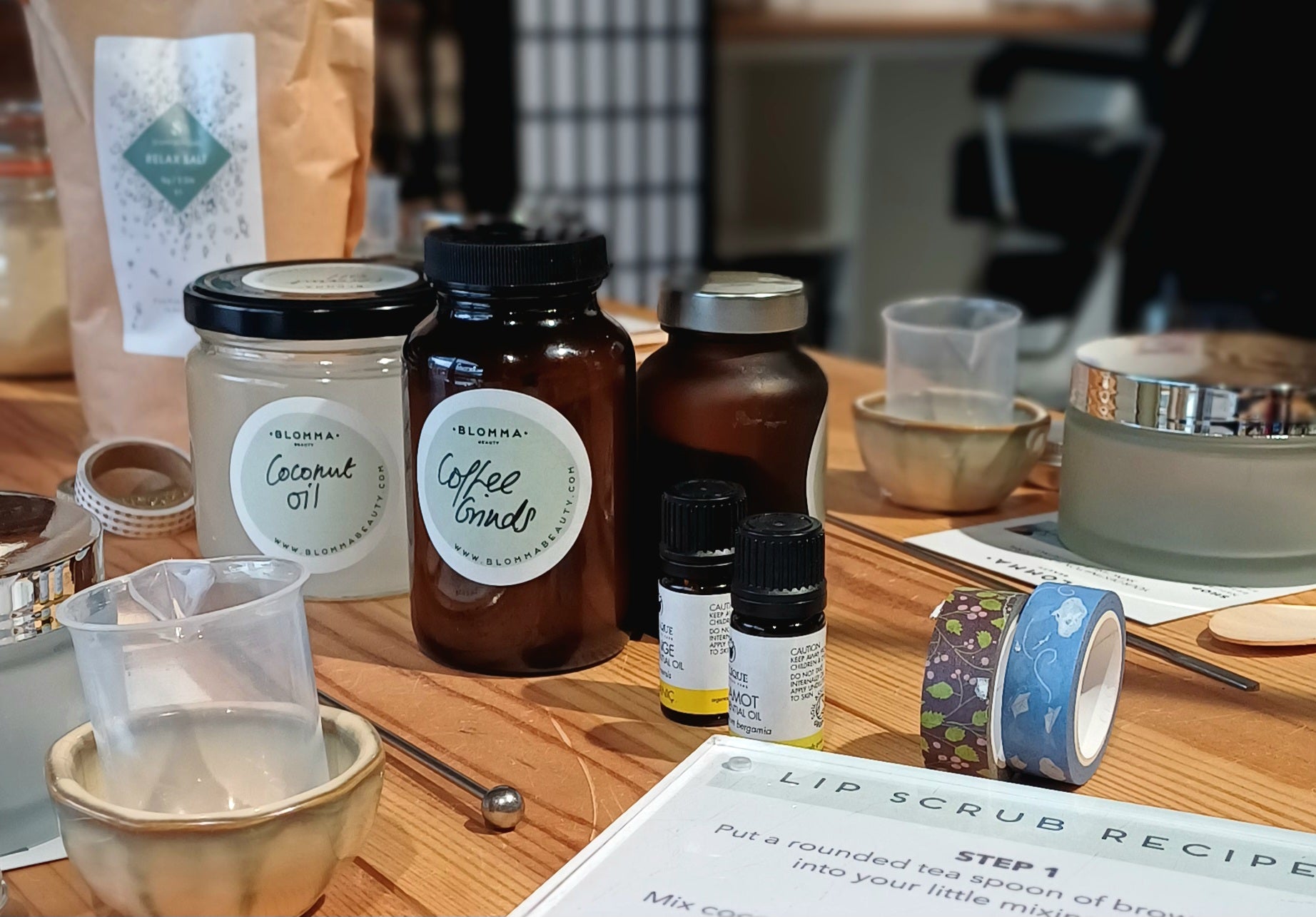 table full of ingredients and decorating pieces for the make your own body scrub workshop