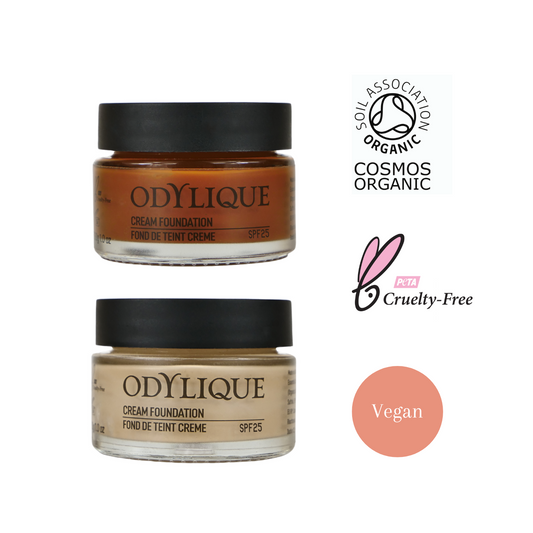 odylique cream foundation graphic showing one darker shade and one lighter shade of foundation in clear glass jars with black plastic lids. To the right is the soil association cosmos organic logo, the peta cruelty free logo and a symbol to denote that the product is vegan
