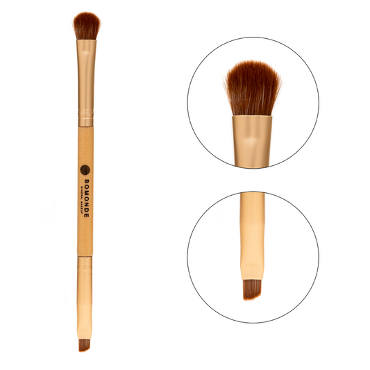 image of bomonde's make up brushes which are wooden with gold coloured ends. this brush has bristles at both ends of the brush. one is a rounded fluffy brush for eyeshadows and the other is a tighter packed angled brush for eyeliners. There is a close up of each brush on the right side of the photo in two circles zoomed in