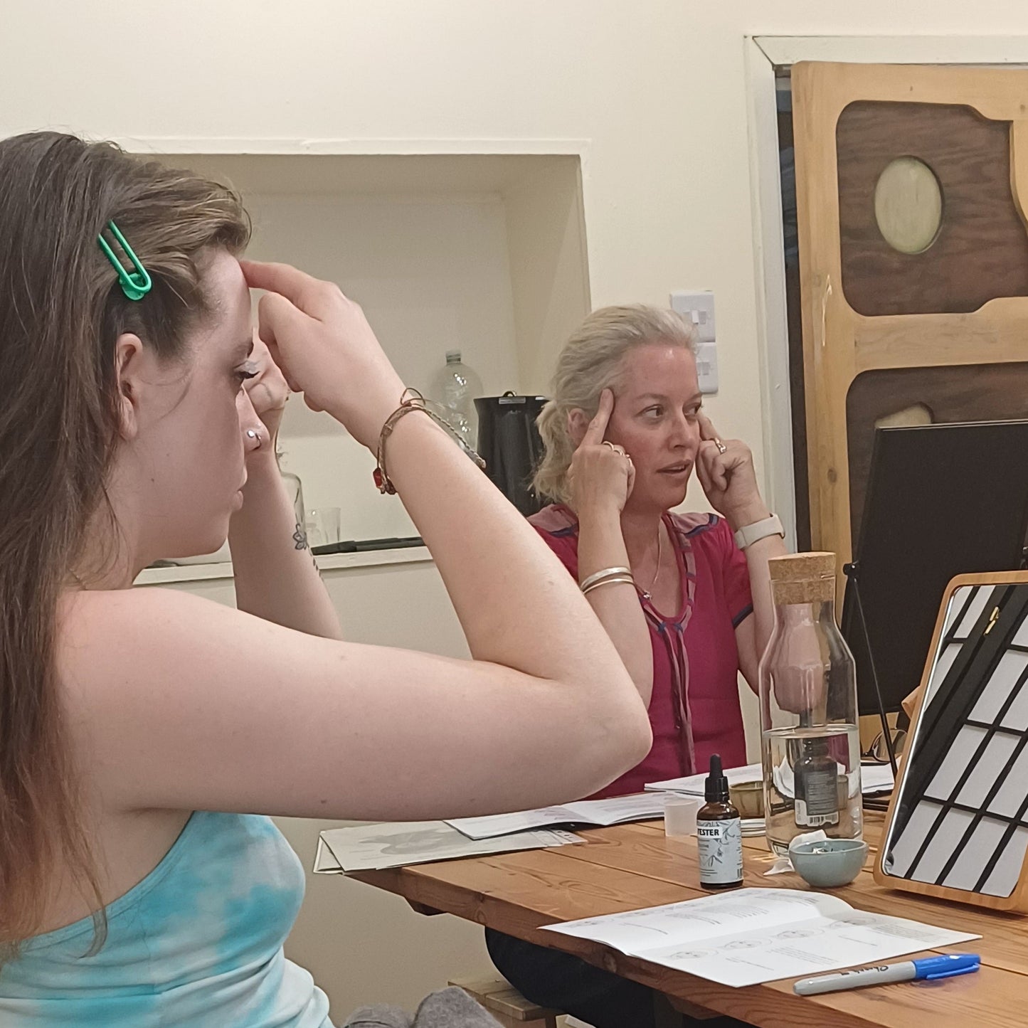 two women a teacher and a pupil of face yoga