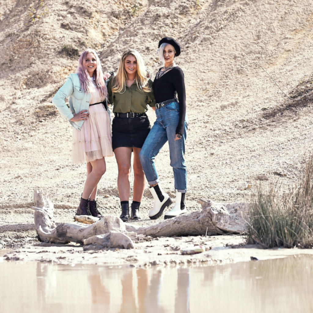 Image of 3 women in sand coloured quarry modelling the Bomonde mineral make up shades