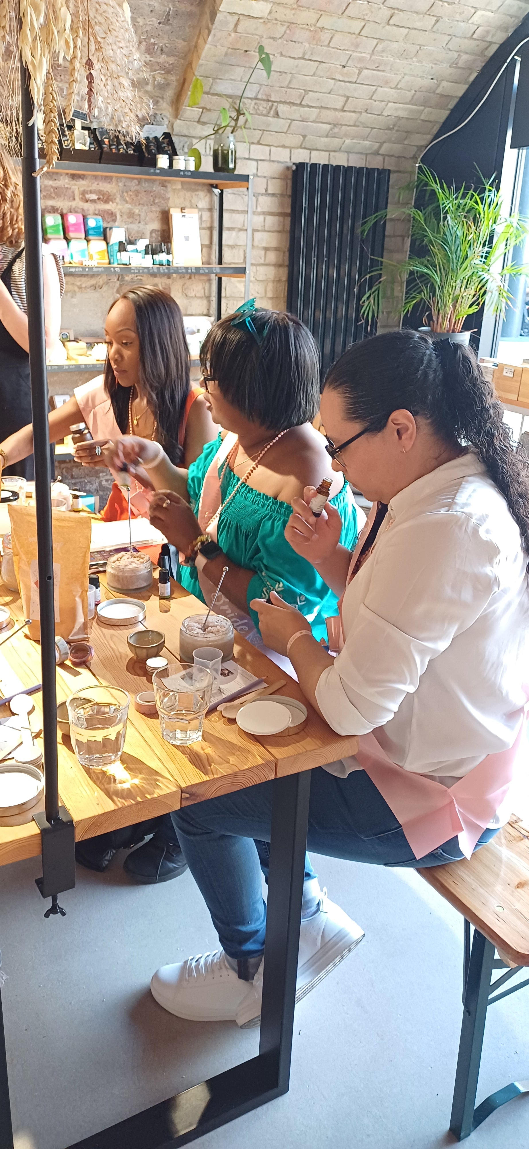 group of hens and bride at hen party making your own natural skincare