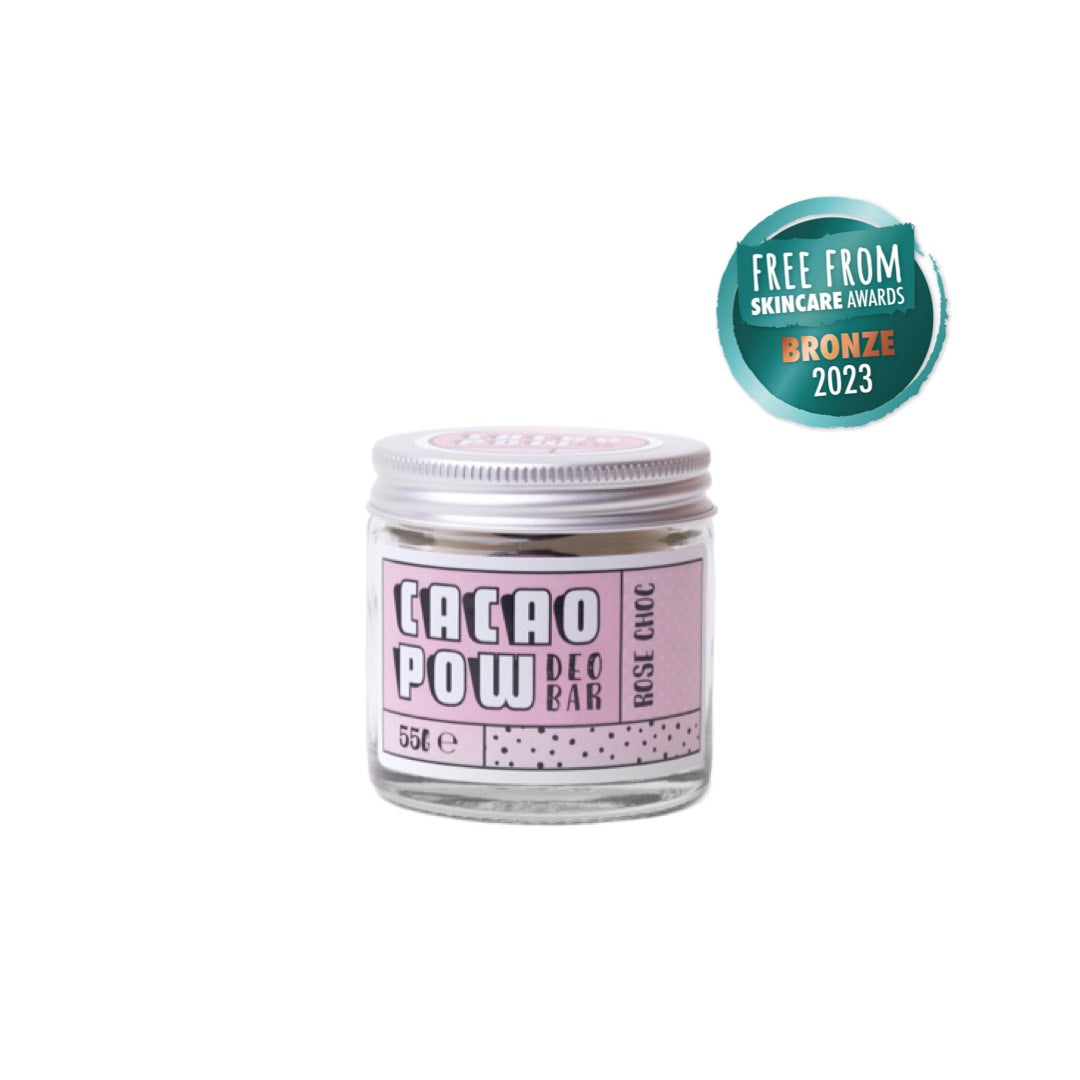 clear jar of cacao pow natural deodorant cream stick with aluminium lid. Rose choc scent with badge to show it won bronze in the free from skincare awards in 2023