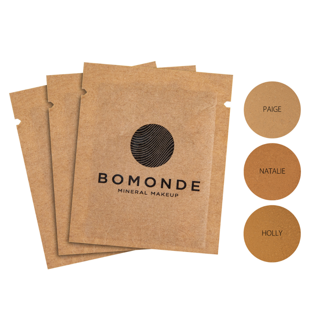 3 sachets of the Bomonde Mineral Foundation samples. To the left, 3 swatches showing shades Paige, Natalie and Holly.
