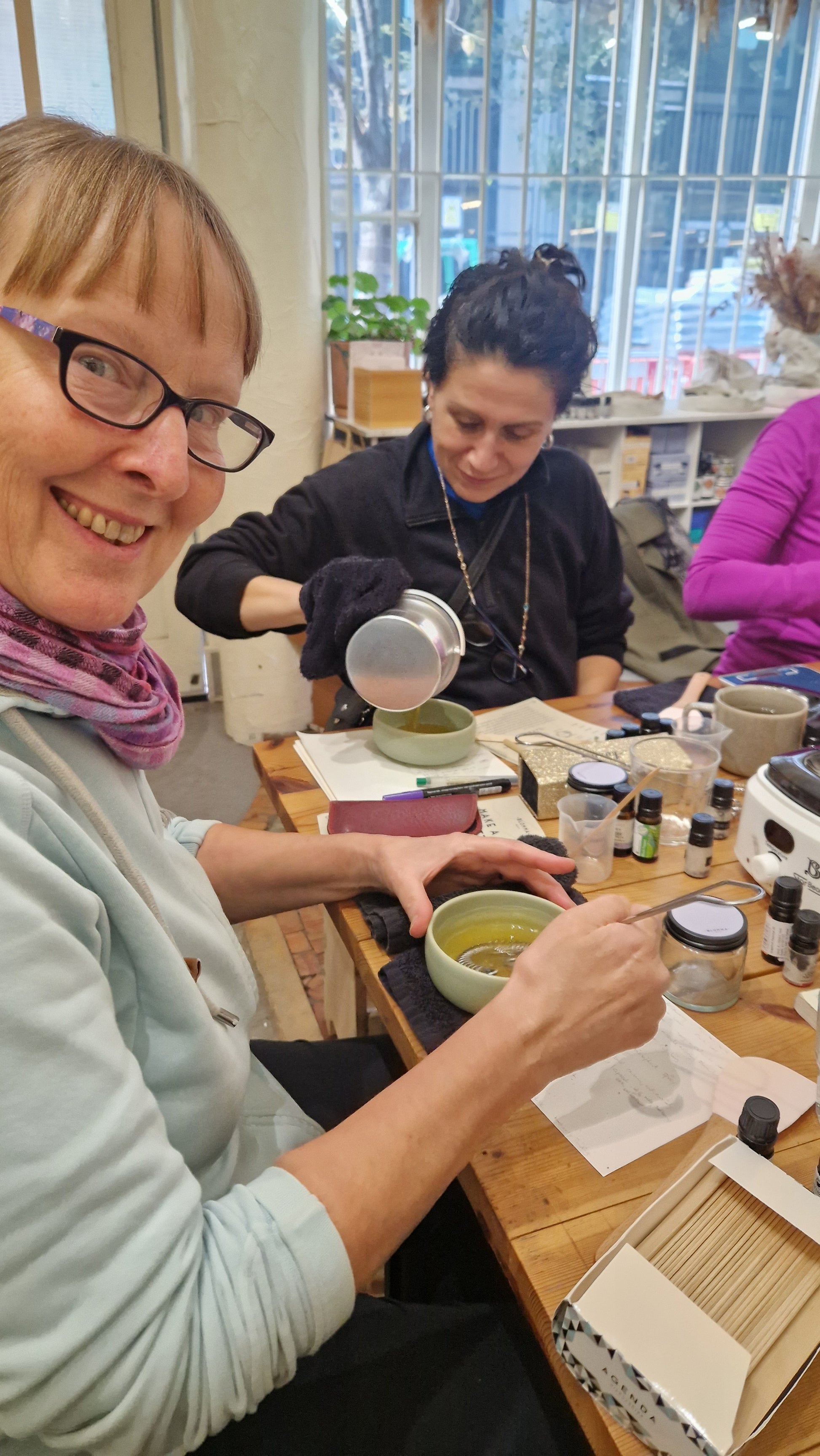 two women creating their own natural skincare products
