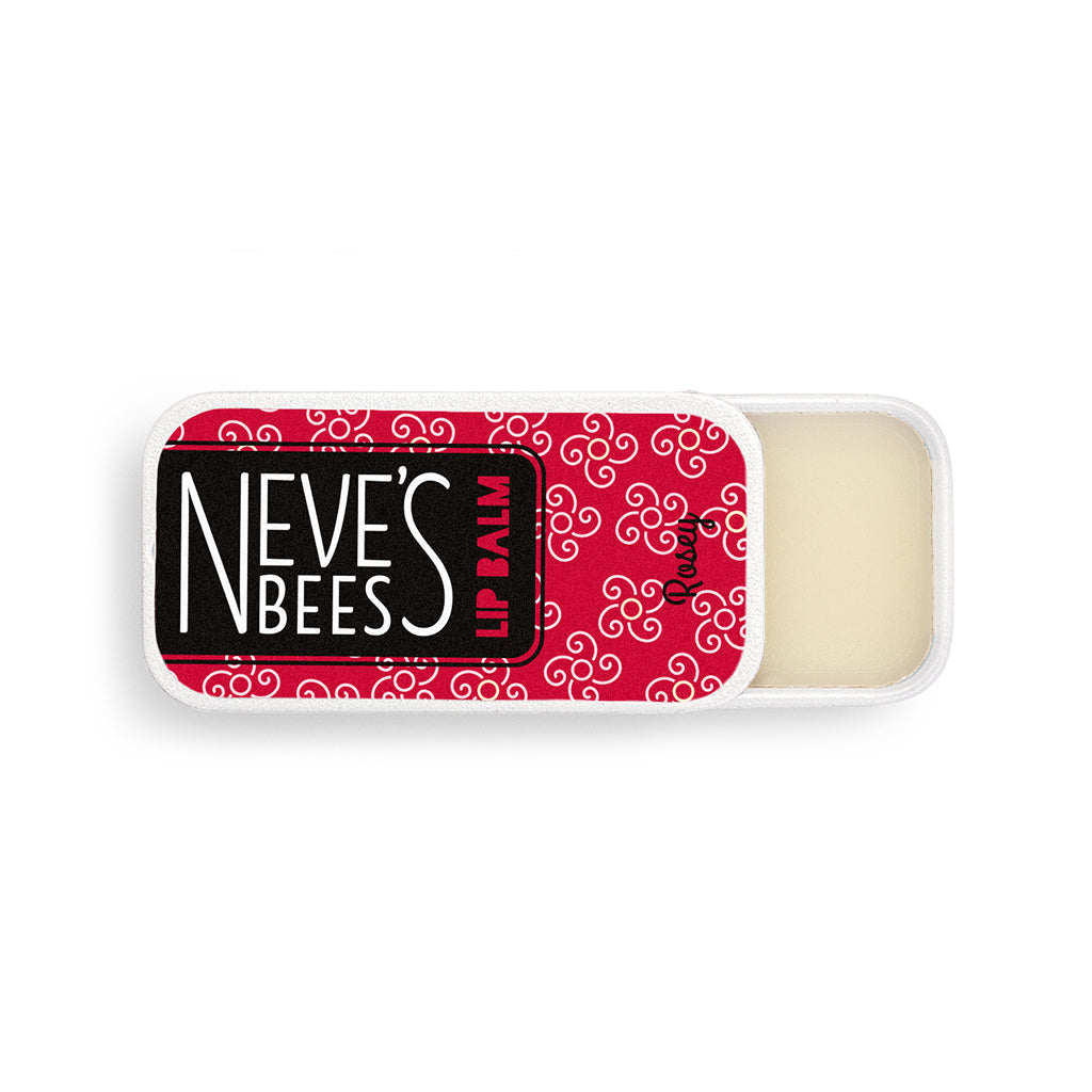 a rectangular aluminium slider tin with rose scented beeswax lip balm inside. on the top of the tin is a red sticker with the neve's bees logo on it and some white flowers drawn on. The tin is slid open and you can see the white creamy texture of the rose lip balm inside