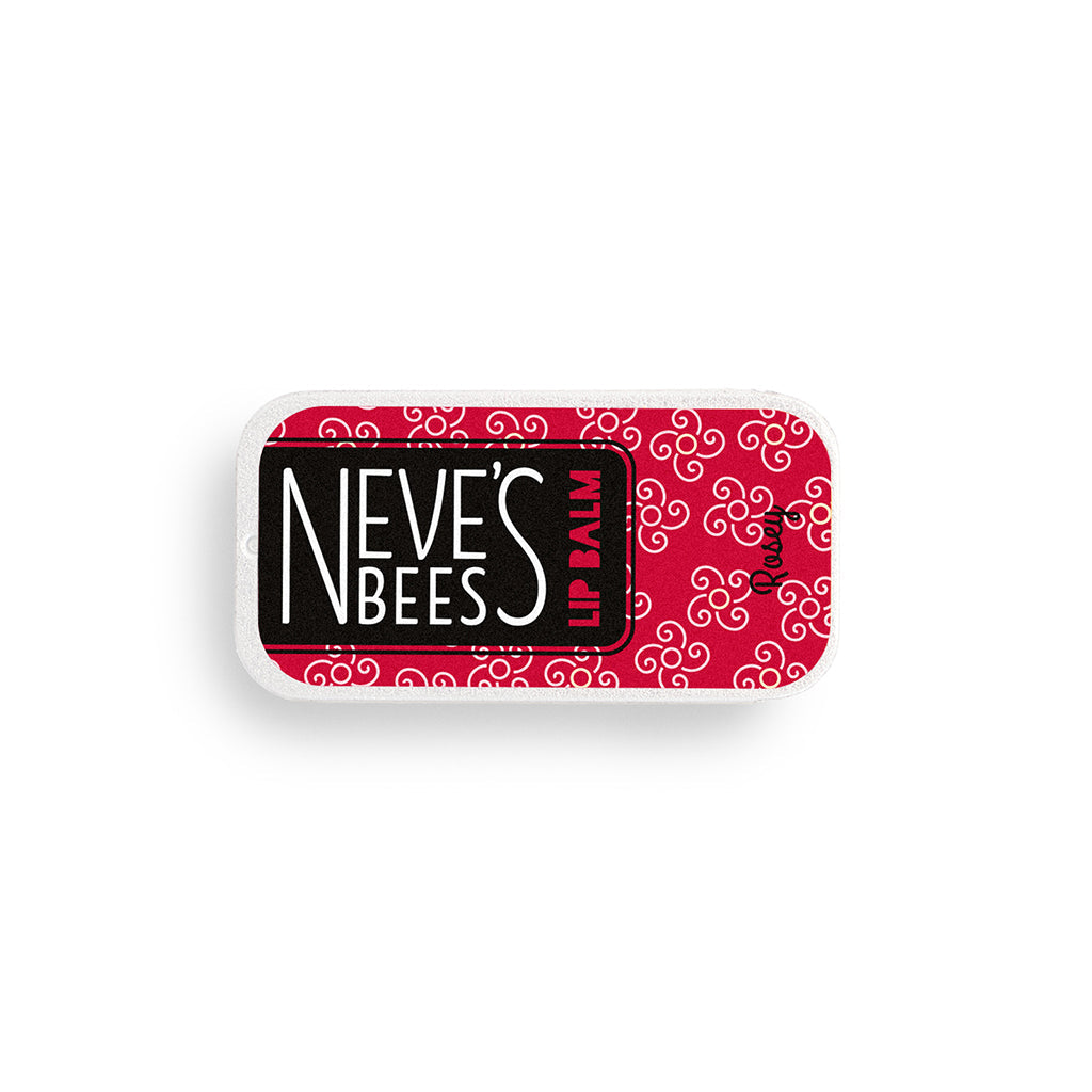 a rectangular aluminium slider tin with rose scented beeswax lip balm inside. on the top of the tin is a red sticker with the neve's bees logo on it and some white flowers drawn on