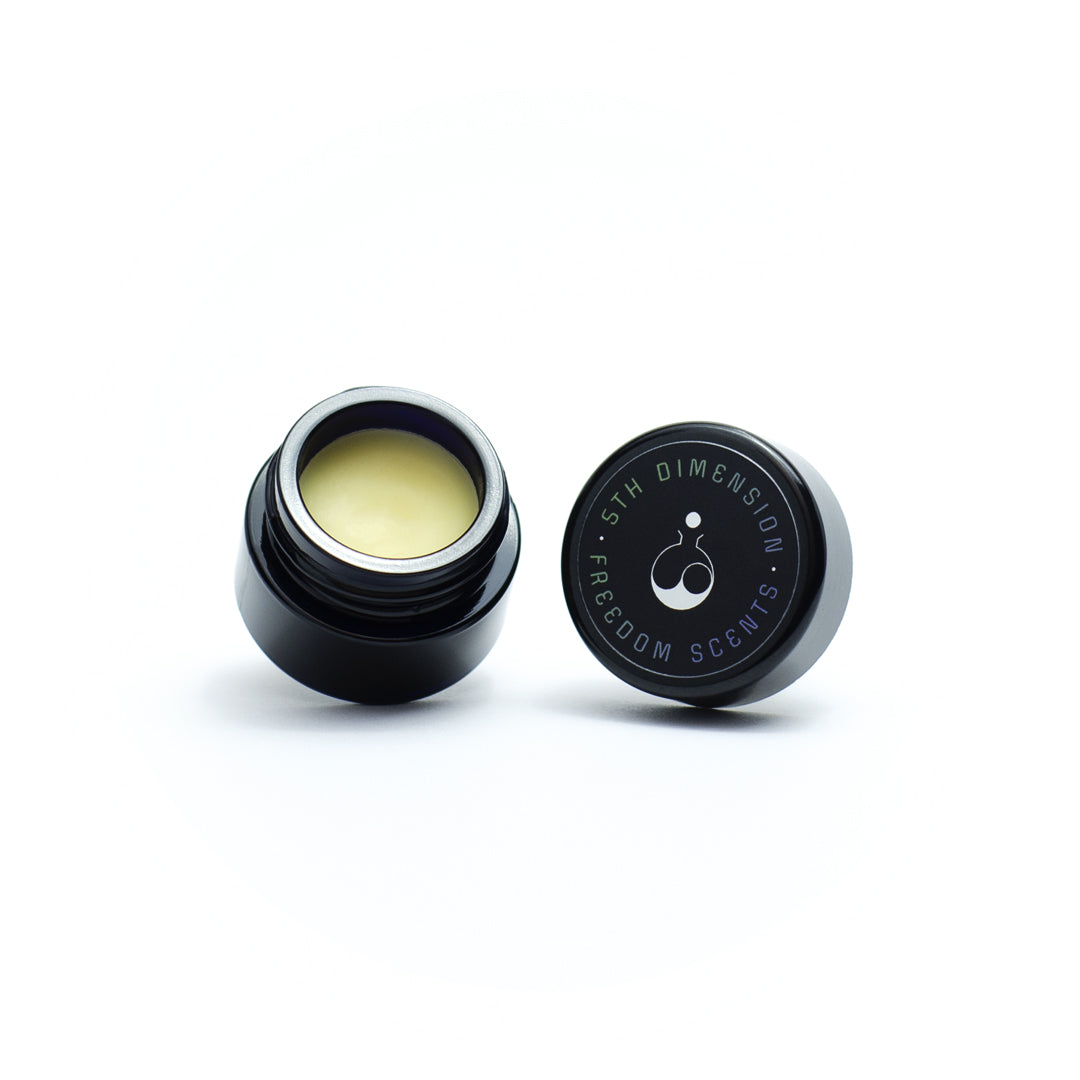 solid perfume balms no 5 alternative little black glass jar with pot and solid perfume inside on white background