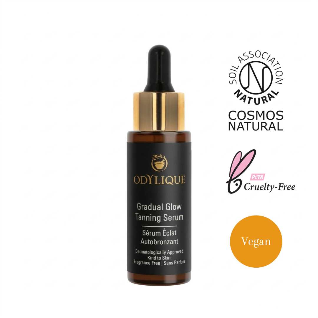 Odylique Gradual Glow Tanning Serum bottle with dropper on a white background, featuring COSMOS Natural and cruelty-free logos.