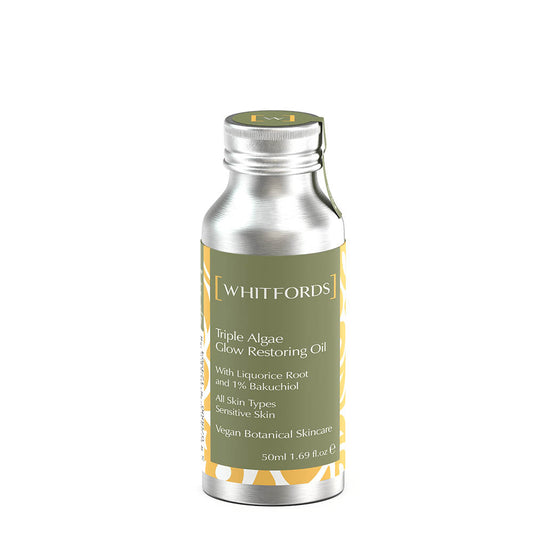 Whitfords skincare face oil with three kinds of skin softening algae in an aluminium bottle with a sage green label on a white background. the label reads 'whitfords triple algae glow restoring oil with liquorice root and 1% bakuchiol. all skin types, sensitive skin. vegan botanical skincare'