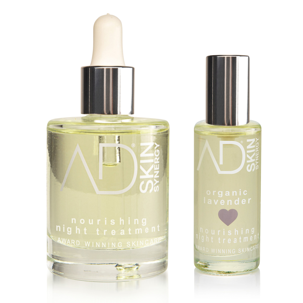 AD Skin Synergy Sleep Duo. Natural night treatment. A full-sized glass bottle with pipette of the original night treatment sits next to a travel sized bottle of the lavender night treatment.