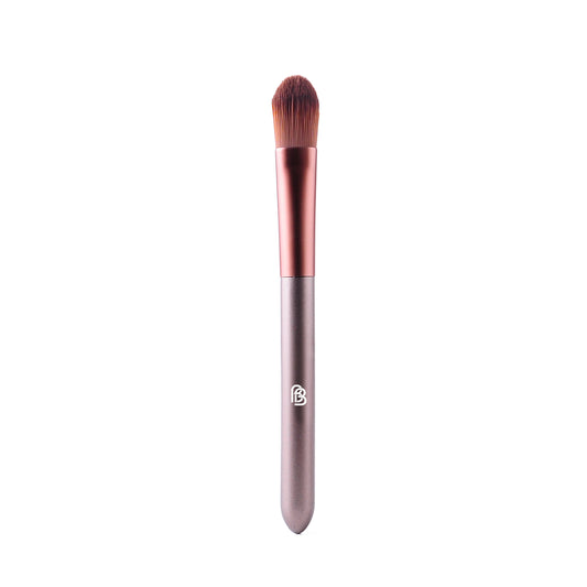 purple/taupe matte plastic handled make up brush with rose gold brown metal section and synthetic bristles flat packed and rounded for the application of foundation and concealer