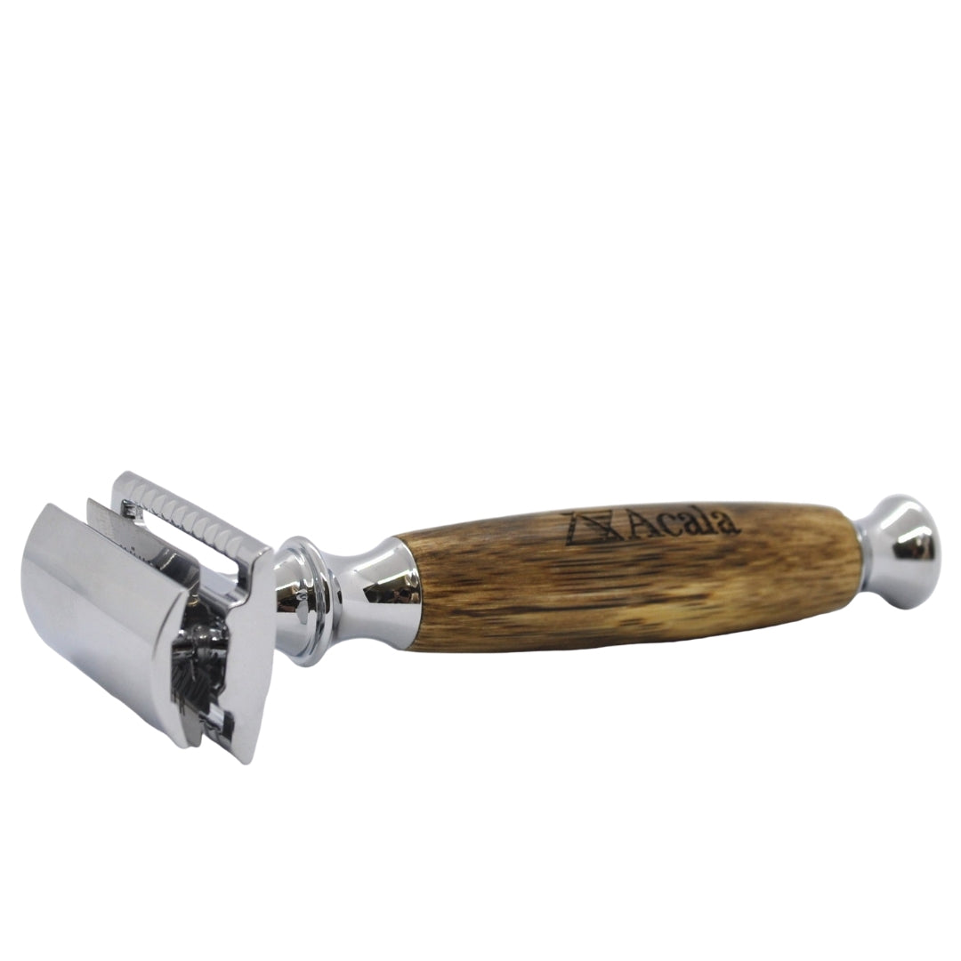 traditional style razor with chrome razor holder and chunky wooden handle embossed with acala's brand name. 