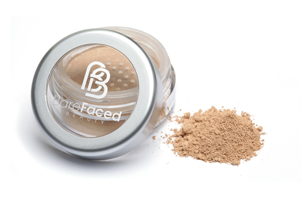 BareFaced Beauty Natural Mineral Foundation in Cherish. Ethical mineral makeup. The powder mineral foundation is pictured in a clear plastic jar with a small pile of the powder sitting next to it.