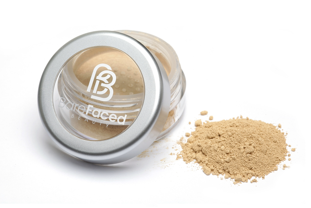 BareFaced Beauty Natural Mineral Foundation in Elegance. Ethical mineral makeup. The powder mineral foundation is pictured in a clear plastic jar with a small pile of the powder sitting next to it.