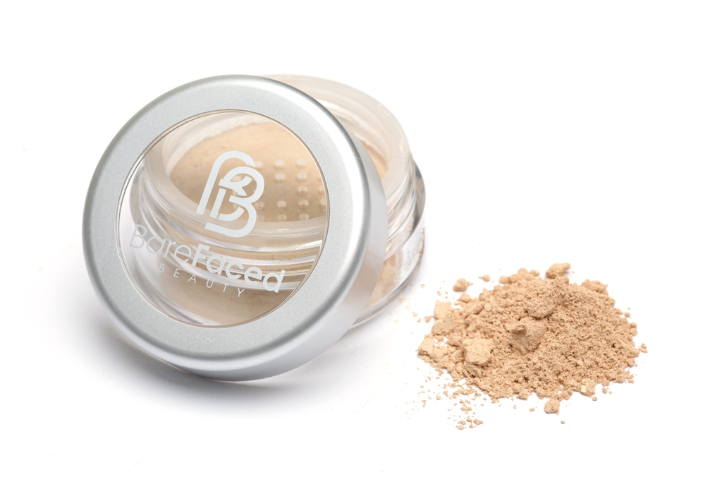 BareFaced Beauty Natural Mineral Foundation in Promise. Ethical mineral makeup. The powder mineral foundation is pictured in a clear plastic jar with a small pile of the powder sitting next to it.