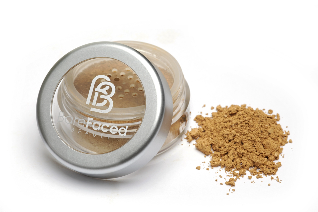 BareFaced Beauty Natural Mineral Foundation in Simple. Ethical mineral makeup. The powder mineral foundation is pictured in a clear plastic jar with a small pile of the powder sitting next to it.