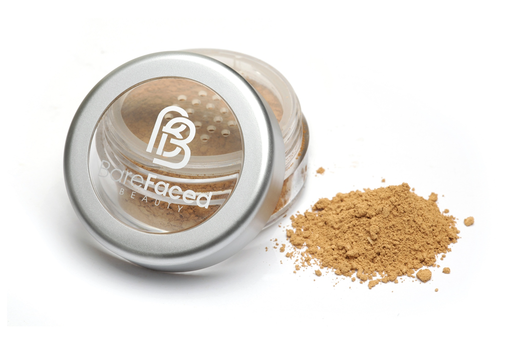 BareFaced Beauty Natural Mineral Foundation in Sincere. Ethical mineral makeup. The powder mineral foundation is pictured in a clear plastic jar with a small pile of the powder sitting next to it.