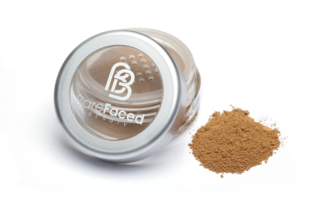 BareFaced Beauty Natural Mineral Foundation in Soft. Ethical mineral makeup. The powder mineral foundation is pictured in a clear plastic jar with a small pile of the powder sitting next to it.
