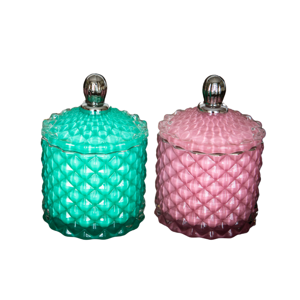 art deco style candle jars with lids in pink and green glass