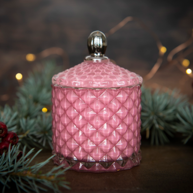 pink art deco style candle jar in christmassy background