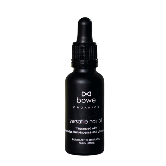 Bowe Organics Versatile Hair Oil. Vegan hair remedies. The oil is pictured in a black glass bottle with white text and a black pipette.