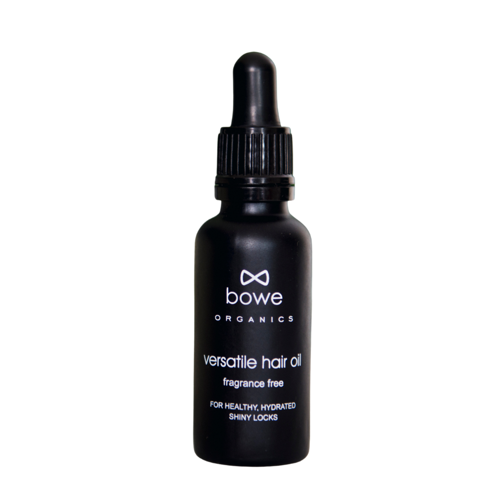 Bowe Organics Versatile Hair Oil. Vegan hair conditioner. The oil is pictured in a black glass bottle with white text and a black pipette.