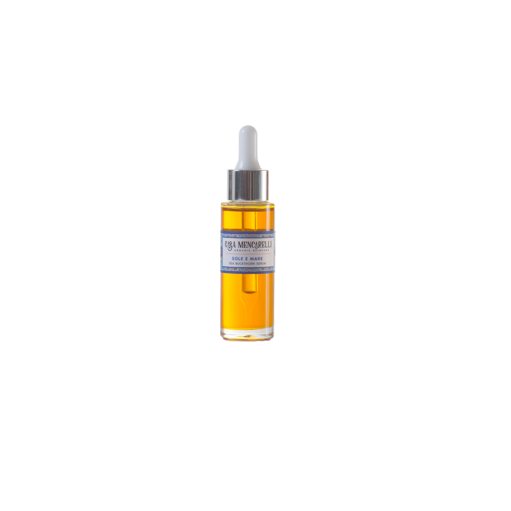 Casa Mencarelli Sole E Mare Sea Buckthorn Serum. Vegan face massage oil. The orange serum is packaged in a clear glass bottle with a label decorated with illustrations of traditional tiling from Umbria in Italy.