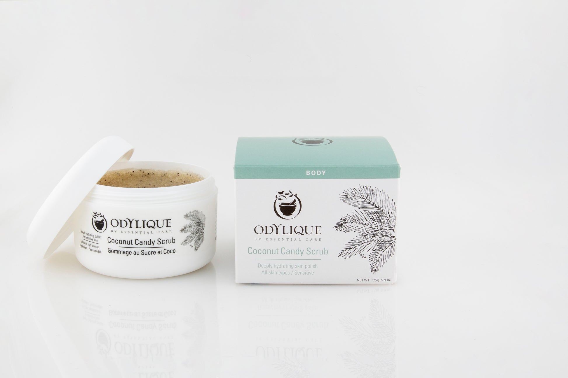Odylique Coconut Candy Scrub. Open jar from the front with box next to it. Organic skincare
