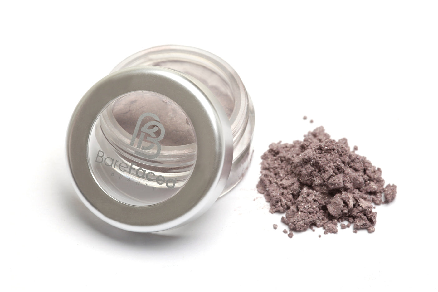 A small round pot of mineral eyeshadow, with a swatch of the powder next to it showing a light shimmery mauve shade