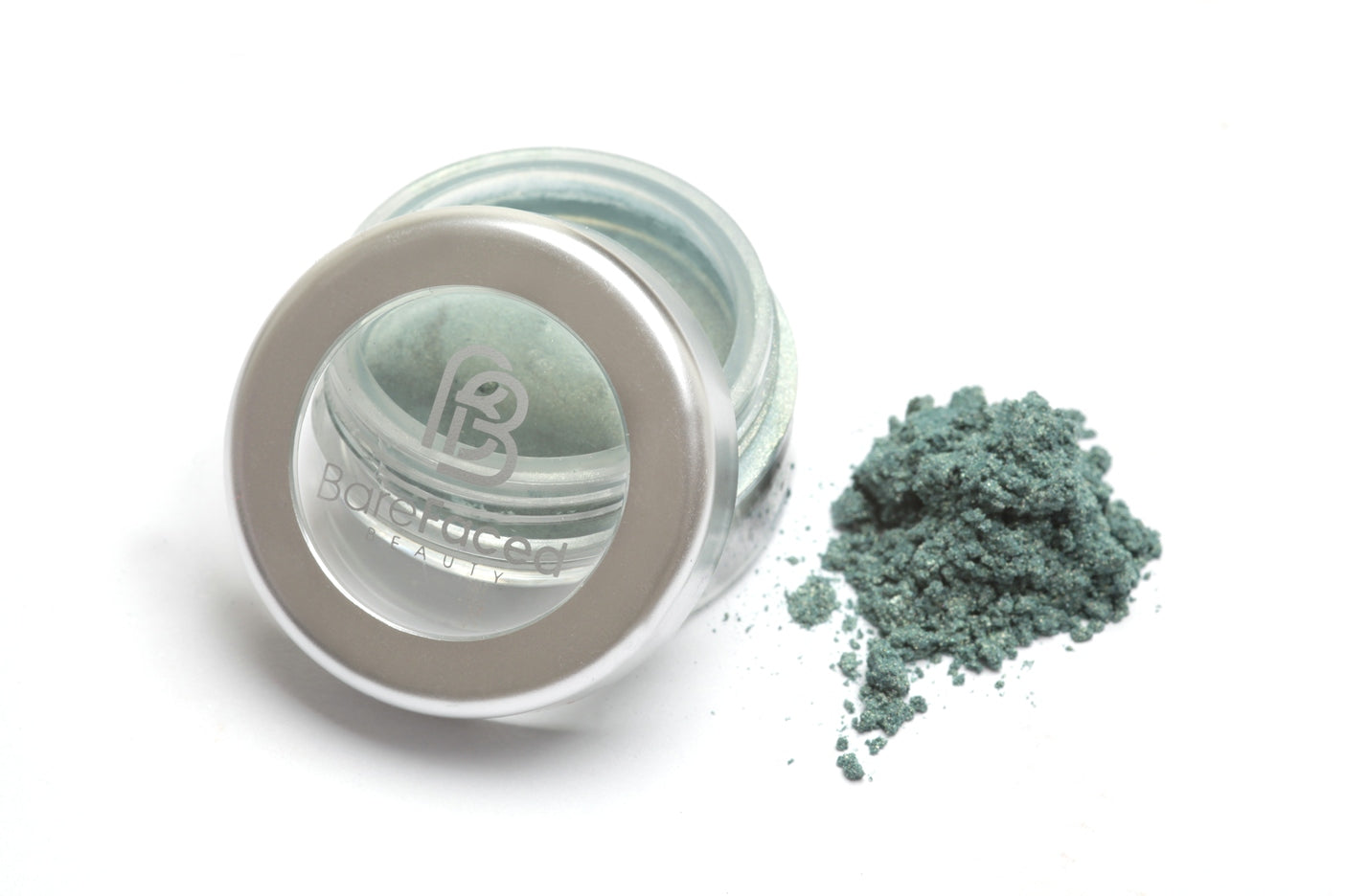 A small round pot of mineral eyeshadow, with a swatch of the powder next to it showing a sparkly aqua marine