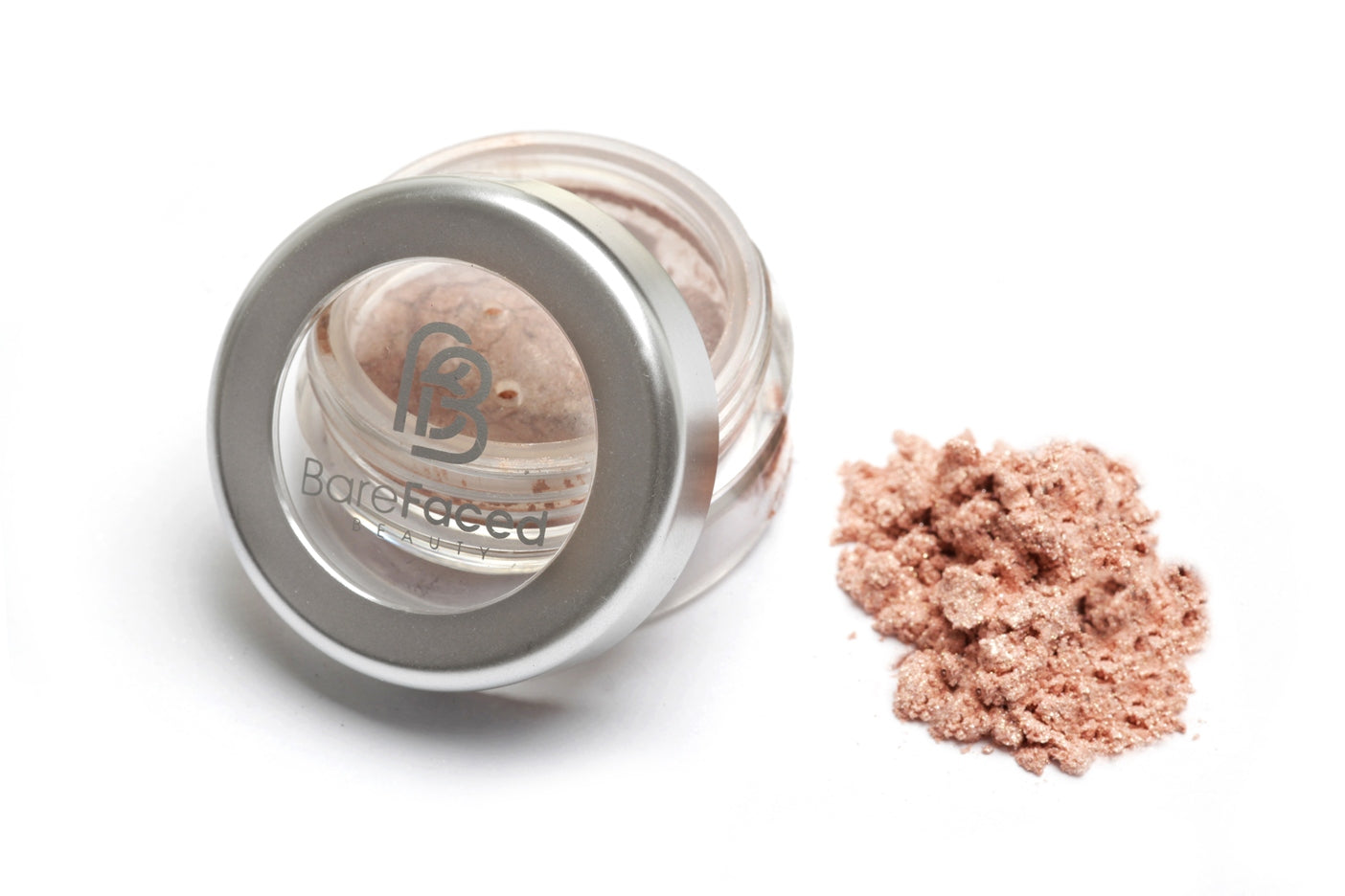 A small round pot of mineral eyeshadow, with a swatch of the powder next to it showing a shimmery pale pink shade