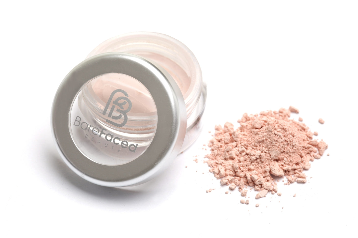 A small round pot of mineral eyeshadow, with a swatch of the powder next to it showing a matt very pale pink shade