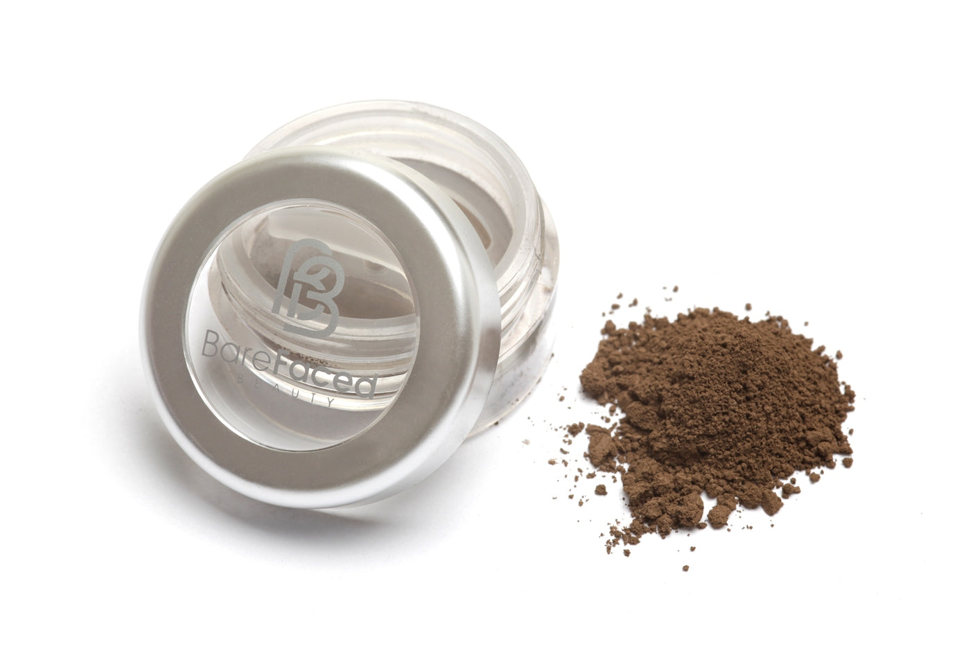 A small round pot of mineral eyeshadow, with a swatch of the powder next to it showing a matt smokey taupe