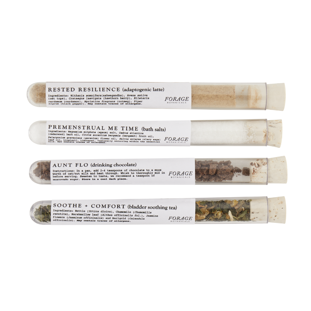 4 test tubes with cork stoppers laid horizontally. Each has a white label on it and a different herbal remedy inside it from forage botanicals. The hormonal health kit includes rested resilience chai latter powder with ashwaghanda and hawthorn, premenstrual me time bath salts with clary sage for hormonal balance and to ease cramps, aunt flo's raw cacao drink for replenishing iron during your period, soothe and comfort tea with lemonbalm and chamomile to soothe bladder irritation
