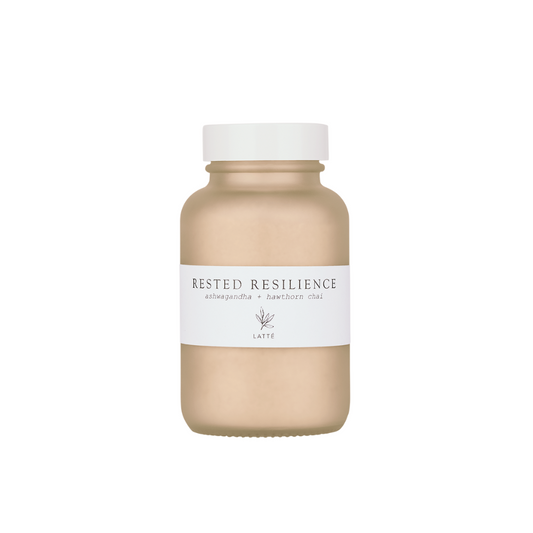 Forage Botanicals Rested Resilience Chai Latte Powder. Natural stress relief. The latte powder is pictured in a smokey glass jar with a simple white label.