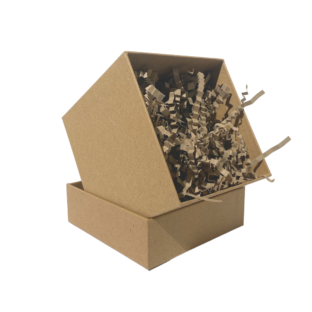 brown kraft cardboard gift box propped up in its lid in a small cube shape filled with brown kraft paper shred
