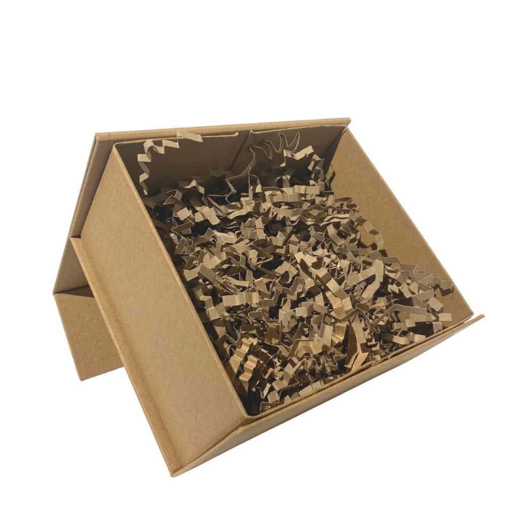 brown kraft cardboard gift box in a rectangular shape filled with brown kraft paper shred. the box has a flip over lid and magnetic fastening 