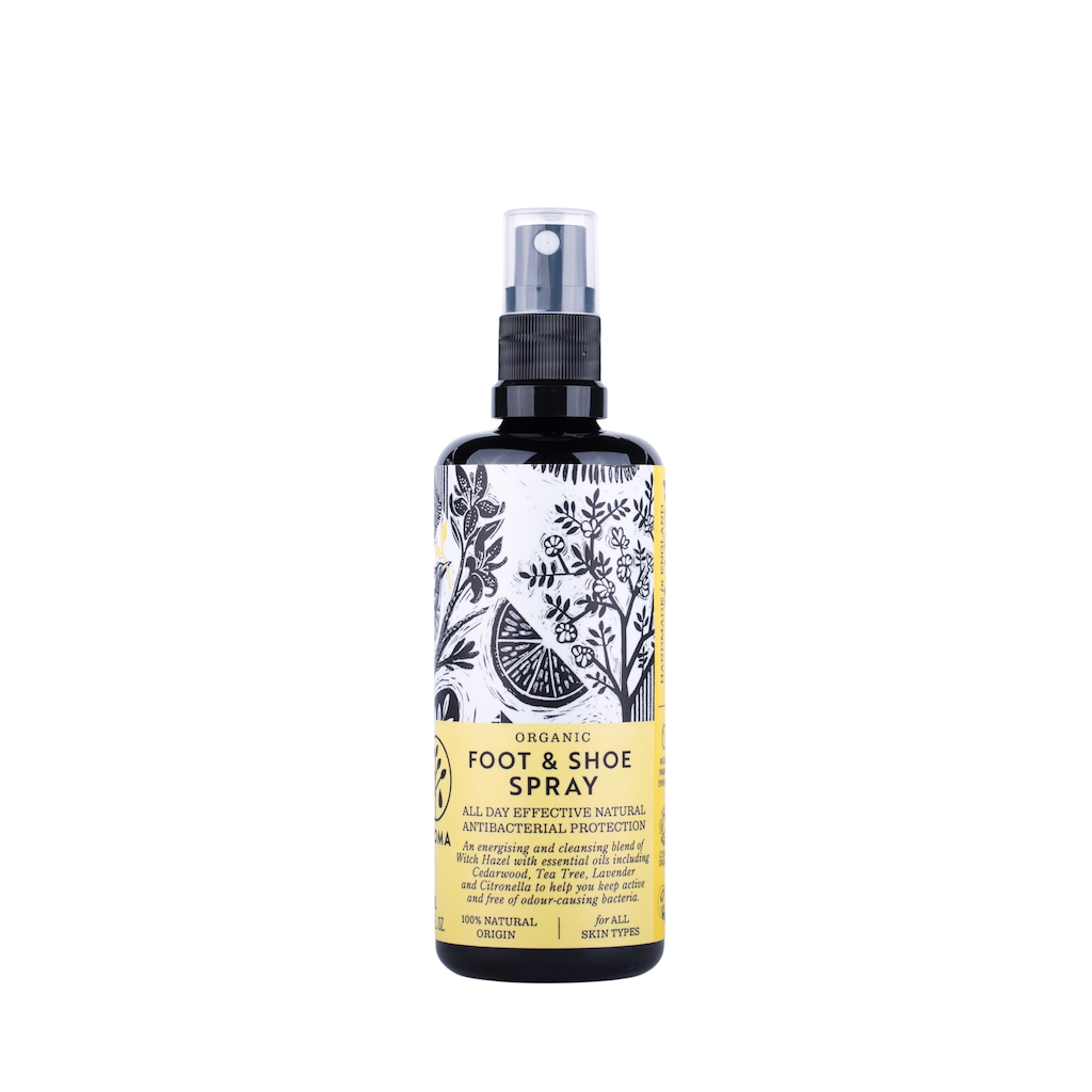 Haoma Organic Foot and Shoe Spray. Certified organic foot smell remedy. The spray is pictured in a black glass bottle with a black plastic spray pump. The label is yellow with black and white illustrations on it.