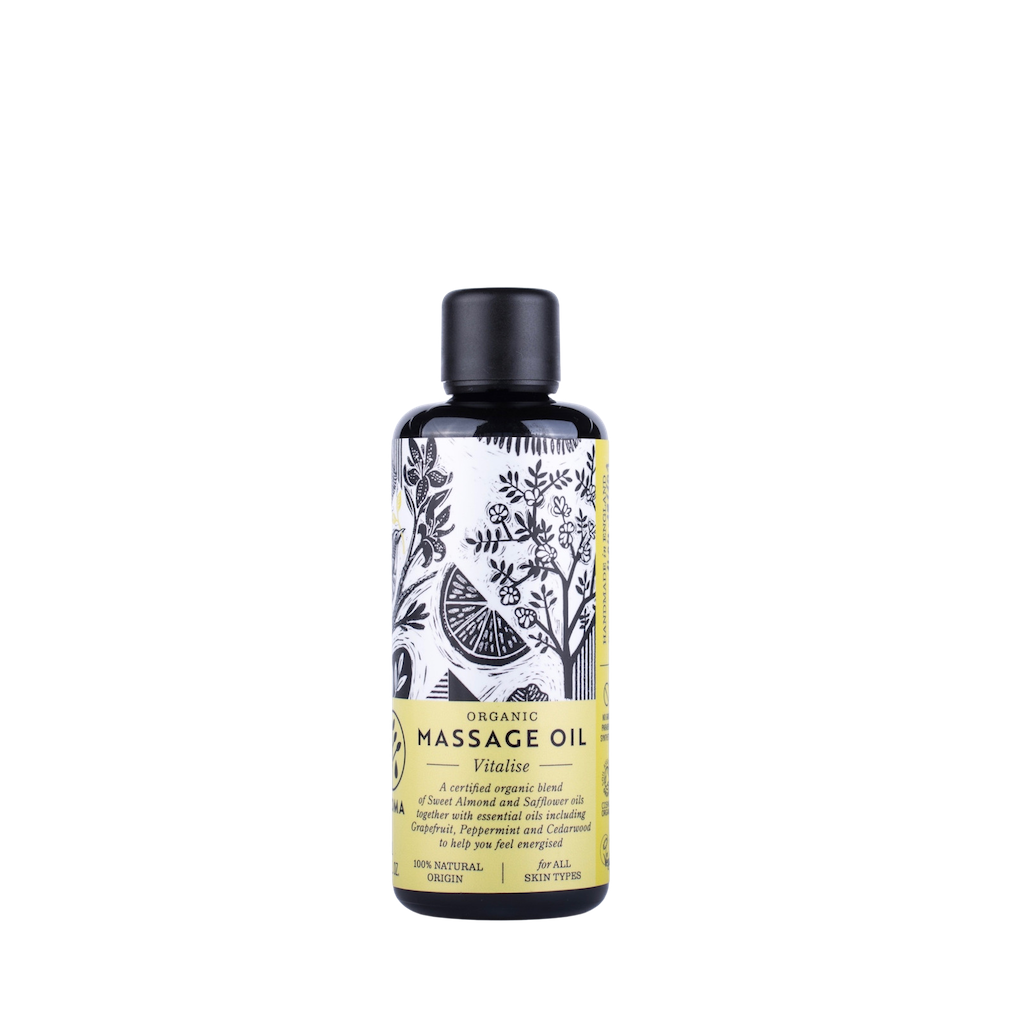 Haoma Organic Massage Oil in Vitalise. Natural massage oil for energy. The body oil is packaged in a black glass bottle with a yellow label and black illustrations of plants.