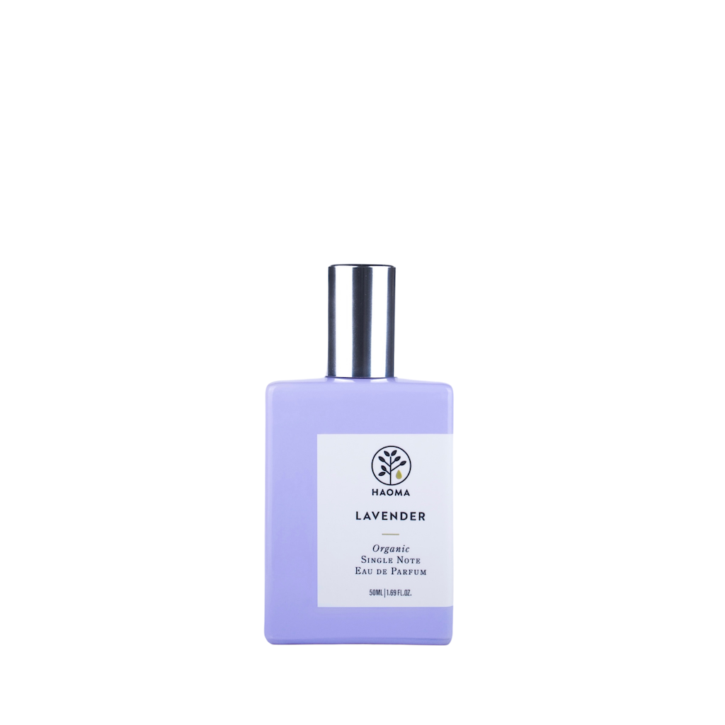 Haoma Organic Eau de Parfum Lavender. Organic perfume. The perfume is pictured in a glass bottle painted purple, with an aluminium cap and white label.